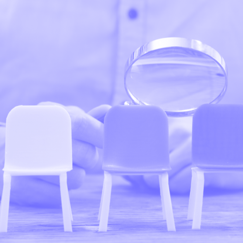 a magnifying glass over a row of chairs